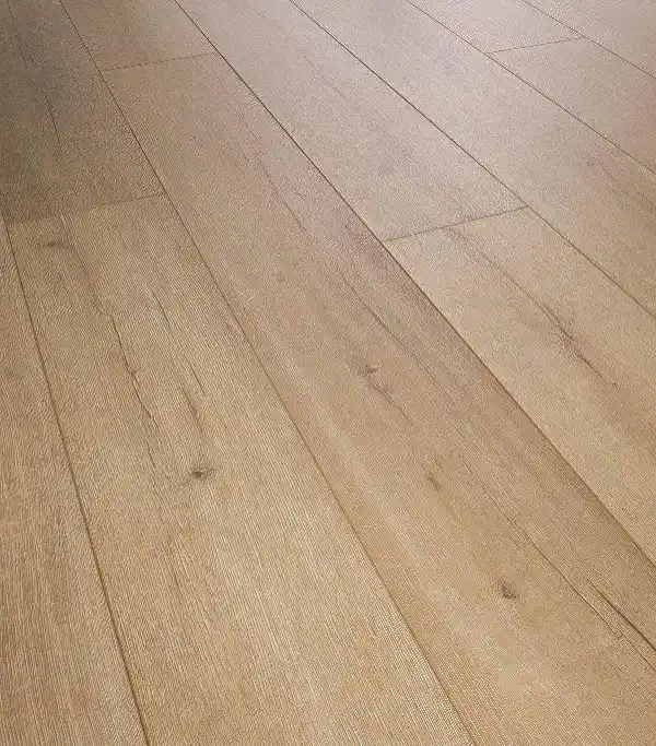 A stylish living room floor featuring affordable laminate flooring, demonstrating that cost-effective choices can still look luxurious.