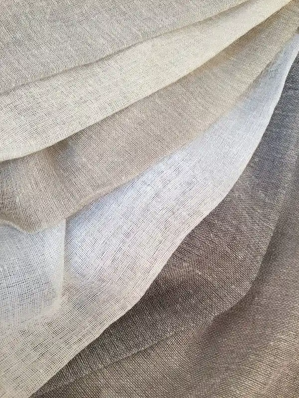 Soft, light filtering curtains in a Mallorca bedroom, offering both style and practical functionality.