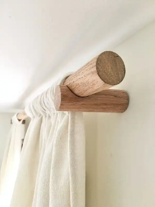 A well-made wooden curtain rod in a Mallorca living room, adding both durability and aesthetic appeal.